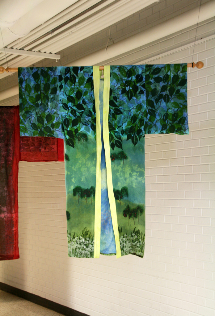 Summer Solstice, 2015, 60H x 52W  Handwoven 2/20’s silk yarn warp and weft sett, 30 threads per inch. Stenciled using the paper lamination from Reflections then overdyed. Details were stenciled in using dyes and textile paints. Fine details were handpainted. Lining is hand dyed commercial silk then stenciled. Photo:  Pete Paterson