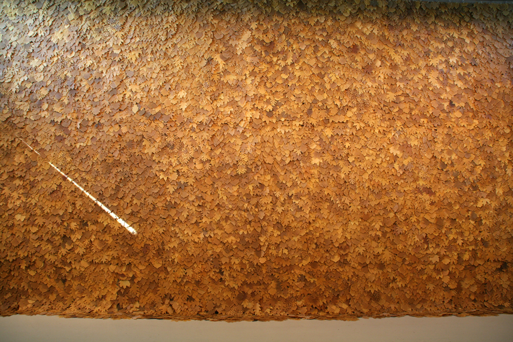 Cleave, a path in the wilderness, 2016, Size variable, 24ft H x 16ft W x 2.5-3in D, plastic/nylon netting, jute threads, 12,000 beeswax leaves.