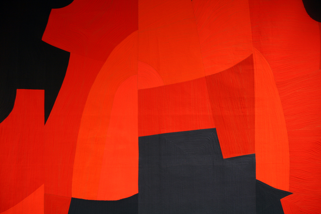 Interactions #27: Head to Head, detail, 2015, 92” H x 90” W, cotton commercial and hand-dyed fabric, cotton and wool batting. Machine pieced quilt designed and machine pieced by Gerri Spilka; quilting is denoted by Gerri Spilka; machine quilting by Marina Baudoin.