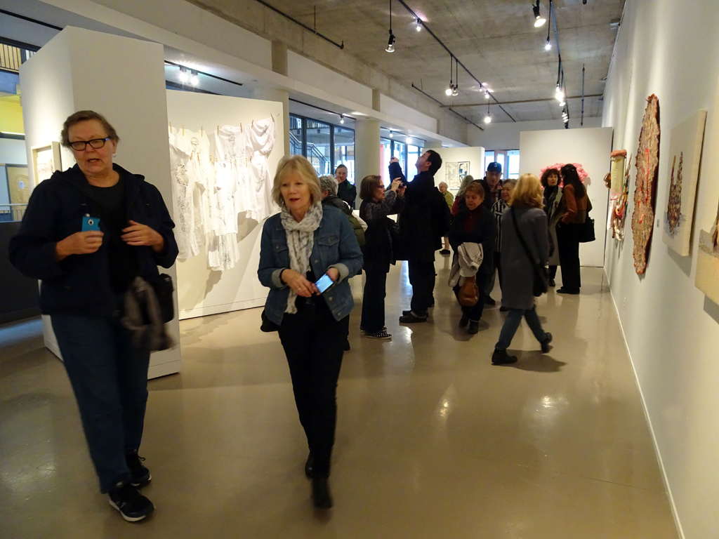 Visitors at the opening of the "me and you" exhibition, World of Threads Festival 2016.