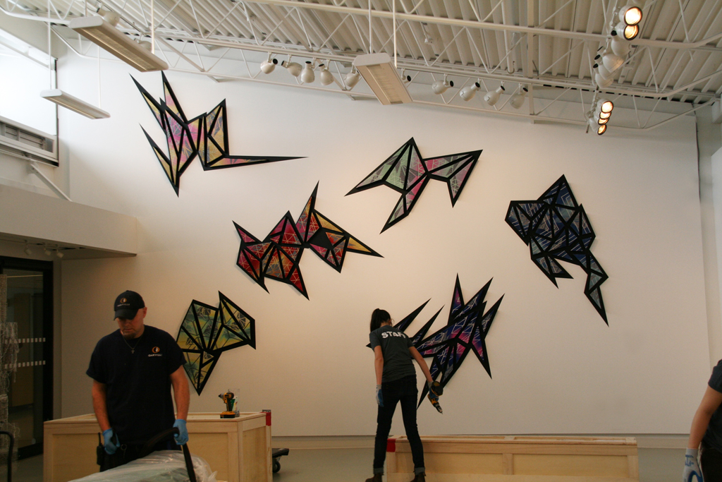 Artist: Heather Macali, Installing her artwork, World of Threads Festival 2016.