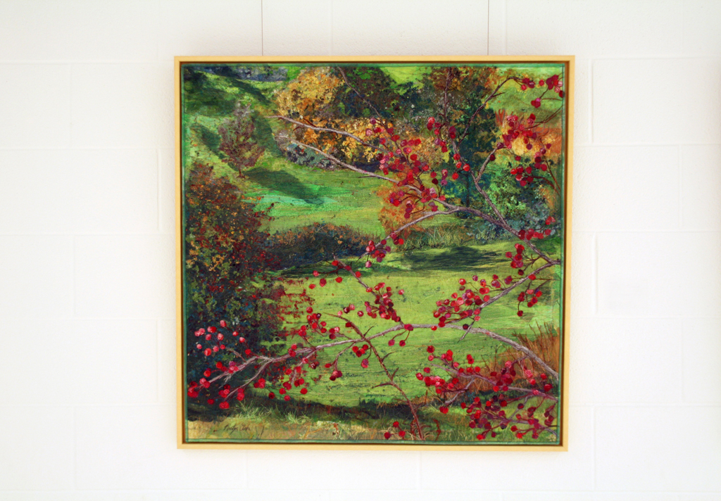 Autumn Branches against Green Hill ,2015, 36H x 36W textile landscape, fabric collage, mixed threads, cotton, silk, synthetic, wool. Technique: collage bound by stitching and netting.  Framed in 1 inch natural maple, stitched onto acid free matt. (No glass).