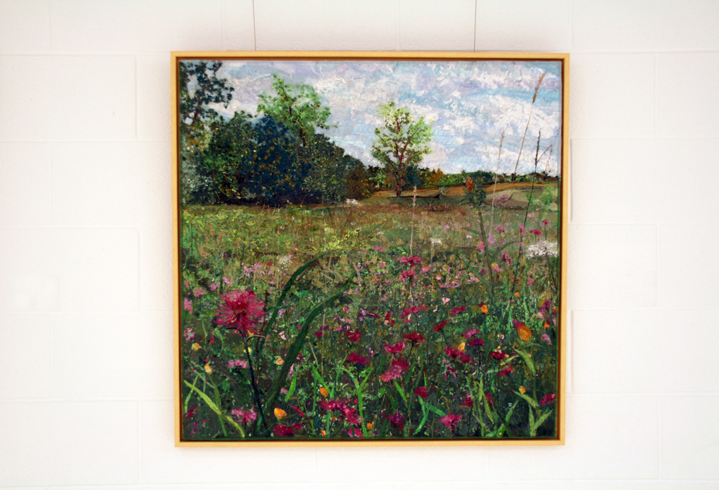 Gray County Flower Field, 2015, 36H x 36W textile landscape, fabric collage, mixed threads, cotton, silk, synthetic, wool. Technique: fabric collage bound by stitching and netting.  Framed in 1 inch wide natural maple, stitched onto acid free matt. (No glass).