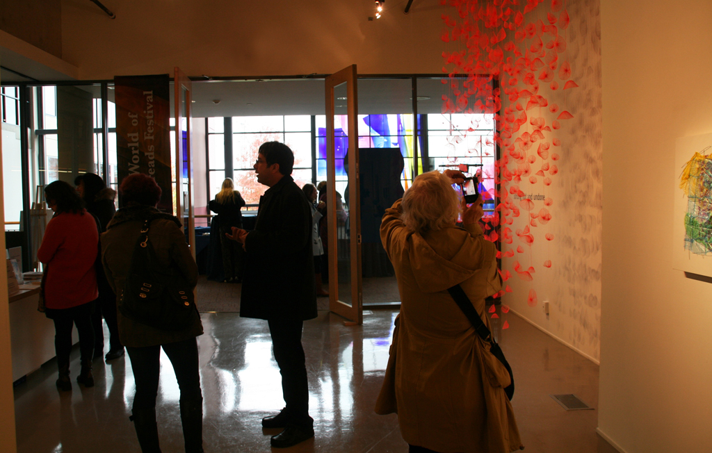 Visitors at the opening of Strung out and Undone exhibition, World of Threads Festival 2014.