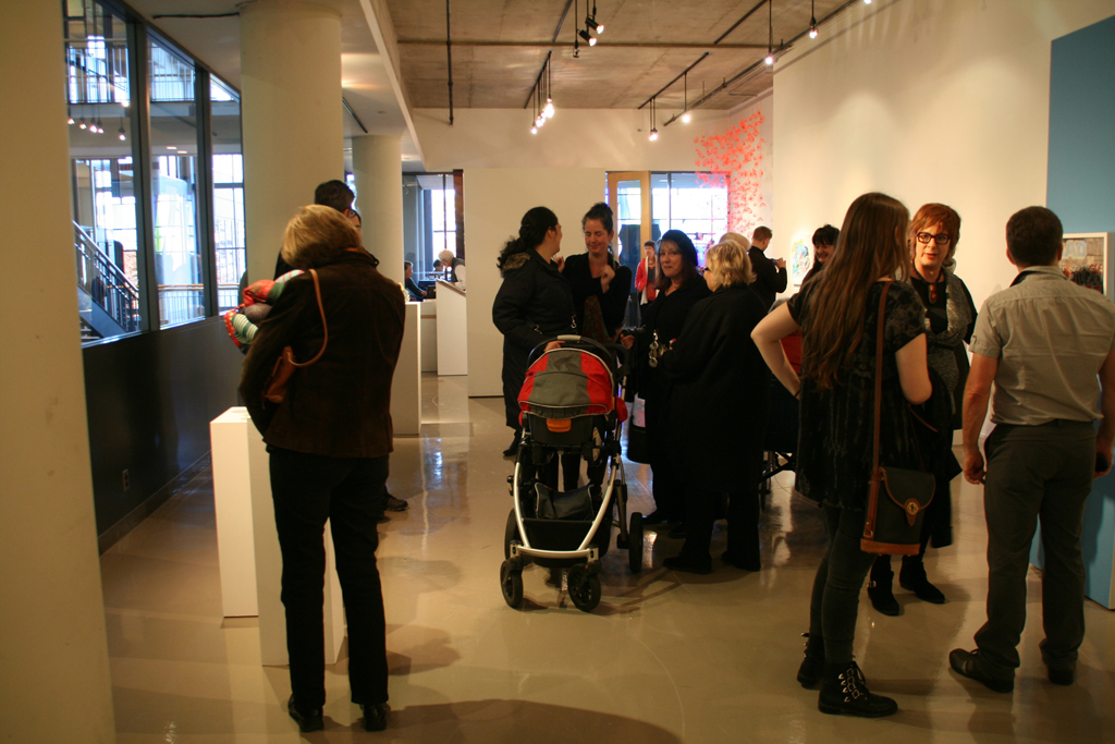Artists and visitors mingle at the opening of Strung out and Undone exhibition, World of Threads Festival 2014.