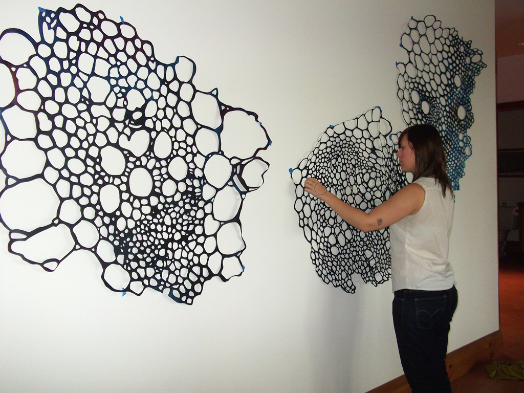 Lizz Aston installing her artwork.,De rerum natura, World of Threads Festival 2012.