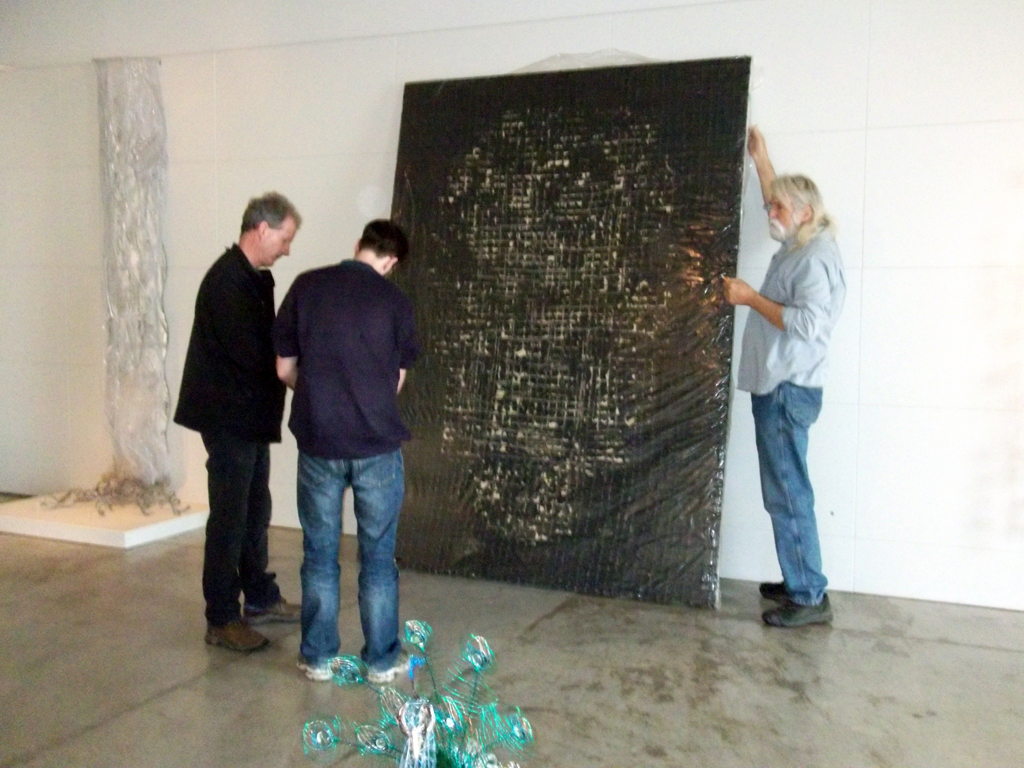 Curator Gareth Bate and installer Jamie Owen taking delivery of artwork.