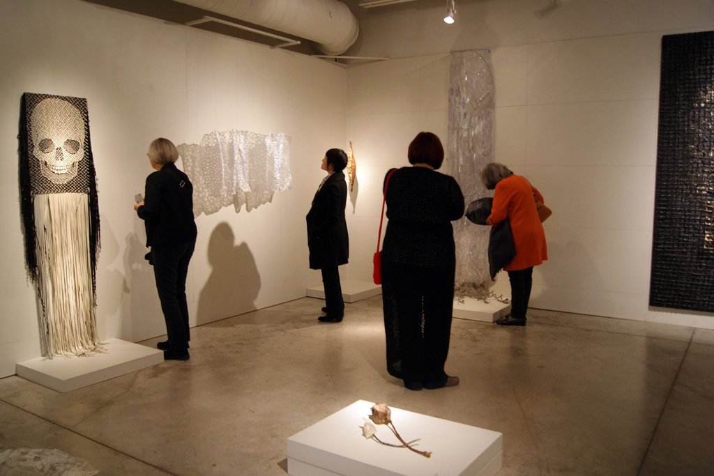 Artists and visitors at the opening of the Memento mori exhibition.