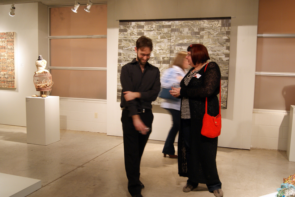 Curator Gareth Bate chatting to artist Lisa Brunetta.