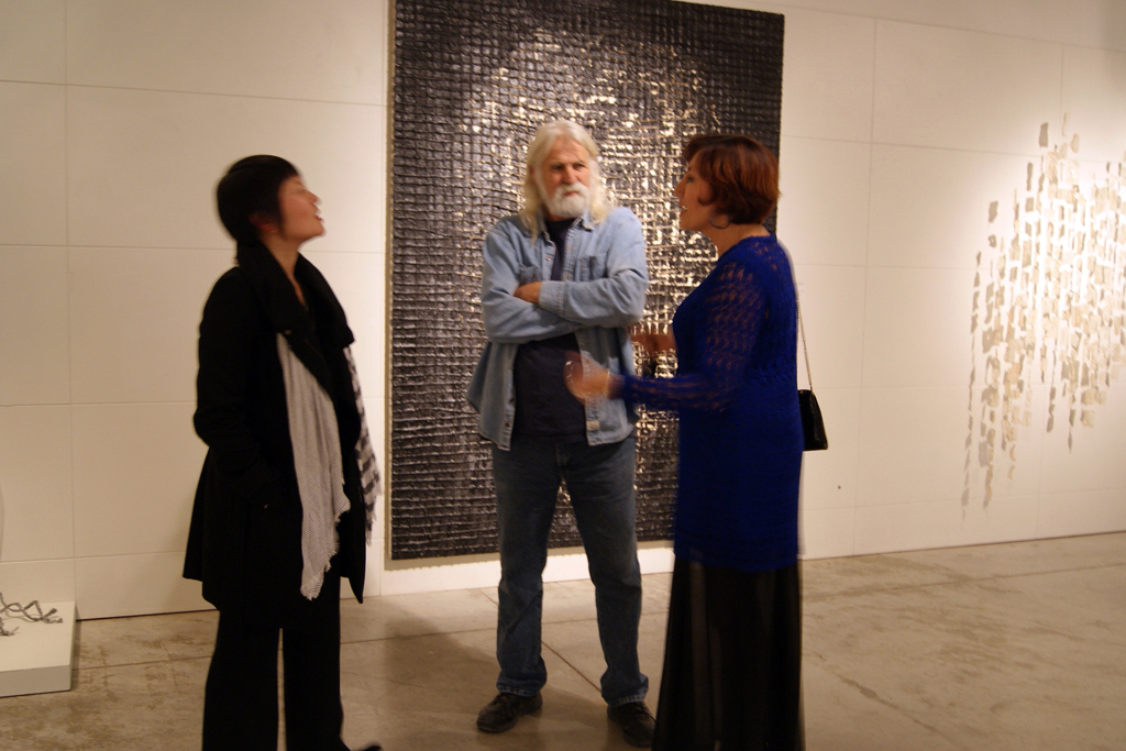 Artists Emily Jan and Ixchel Suarez chatting to Installer Jamie Owen.