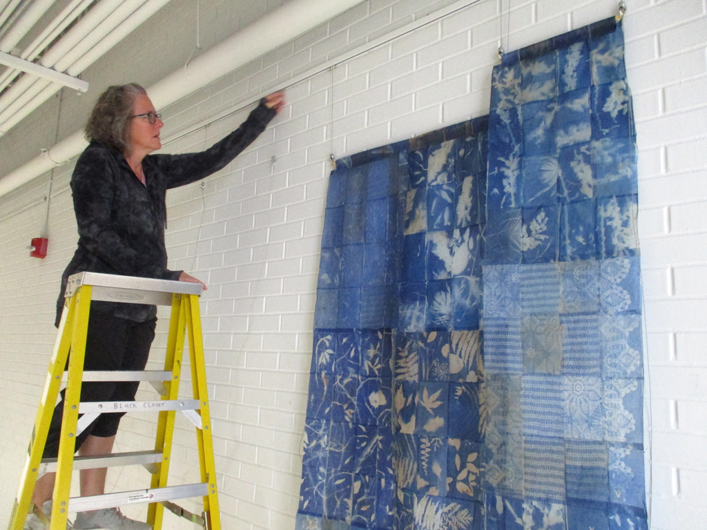 Festival Installer: Heidi installing Filmentous installation, World of Threads Festival 2023-24.