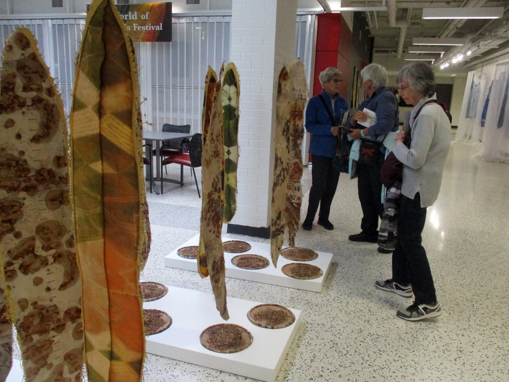 Visitors looking at the Before installation, World of Threads Festival 2023-24.