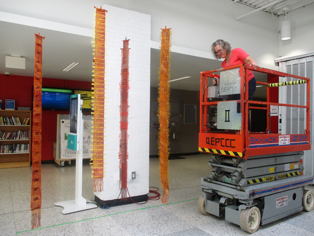Festival installer: Heidi, working on the Diaphanous installation, World of Threads Festival 2023-24.