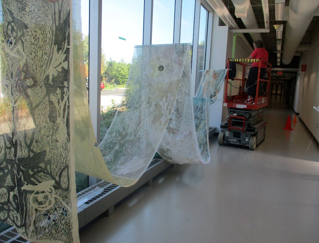 Festival installer: Heidi installing the Flow installation, World of Threads Festival 2023-24.