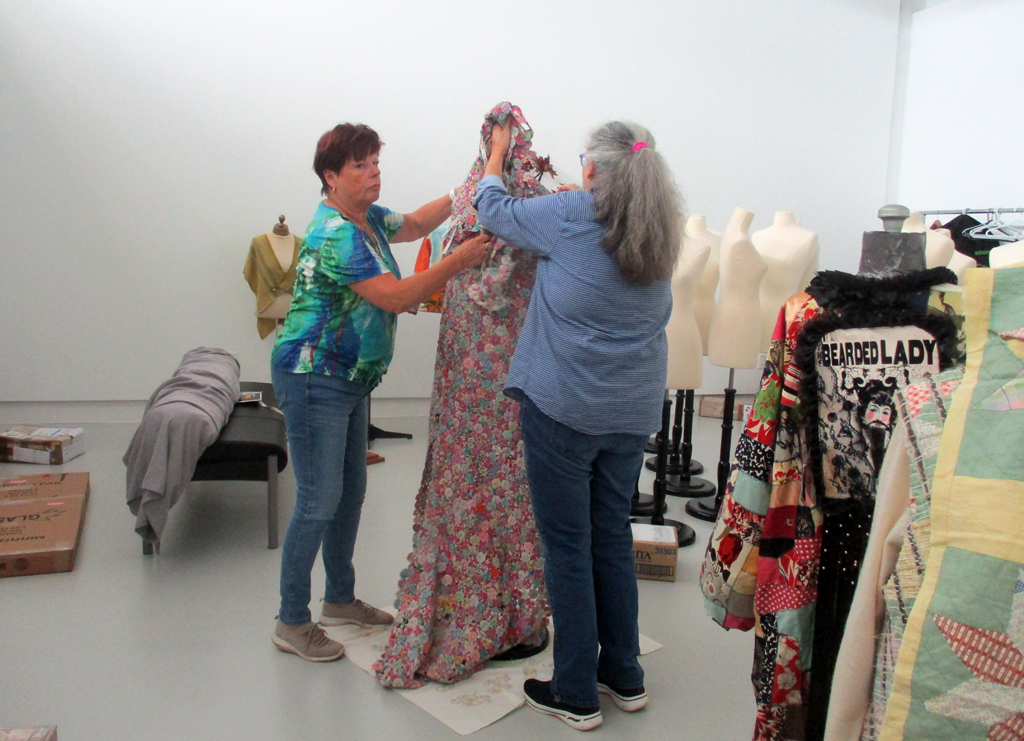 Festival Installers: Freda and Jean, installing work for Cat Walk III, World of Threads Festival 2023-24.