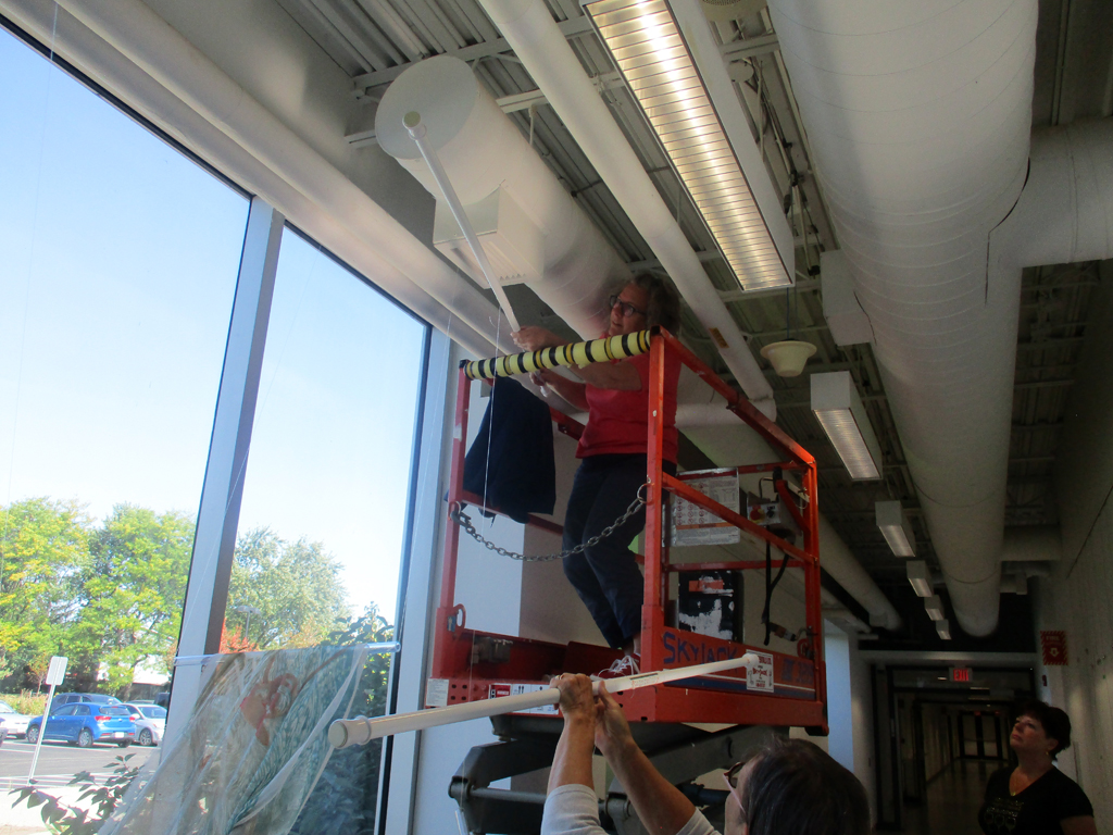 Festival installer: Heidi installing the Flow installation, World of Threads Festival 2023-24.