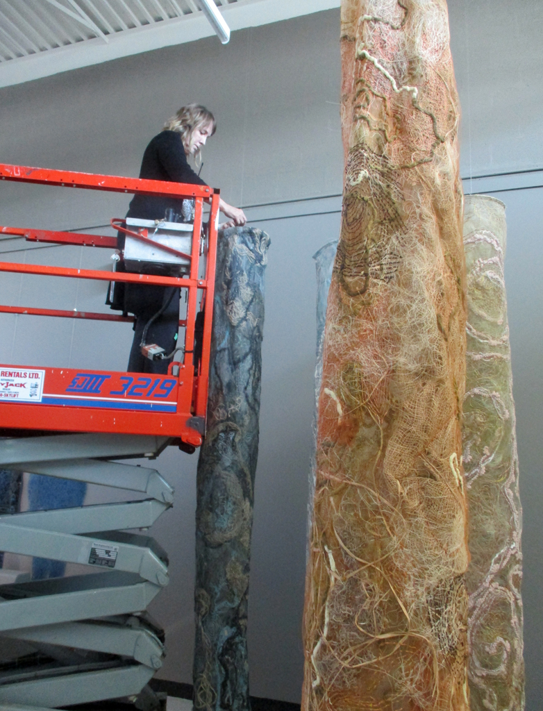 Installer: Dianne, installing Laurentian Forest, World of Threads Festival 2023-24.