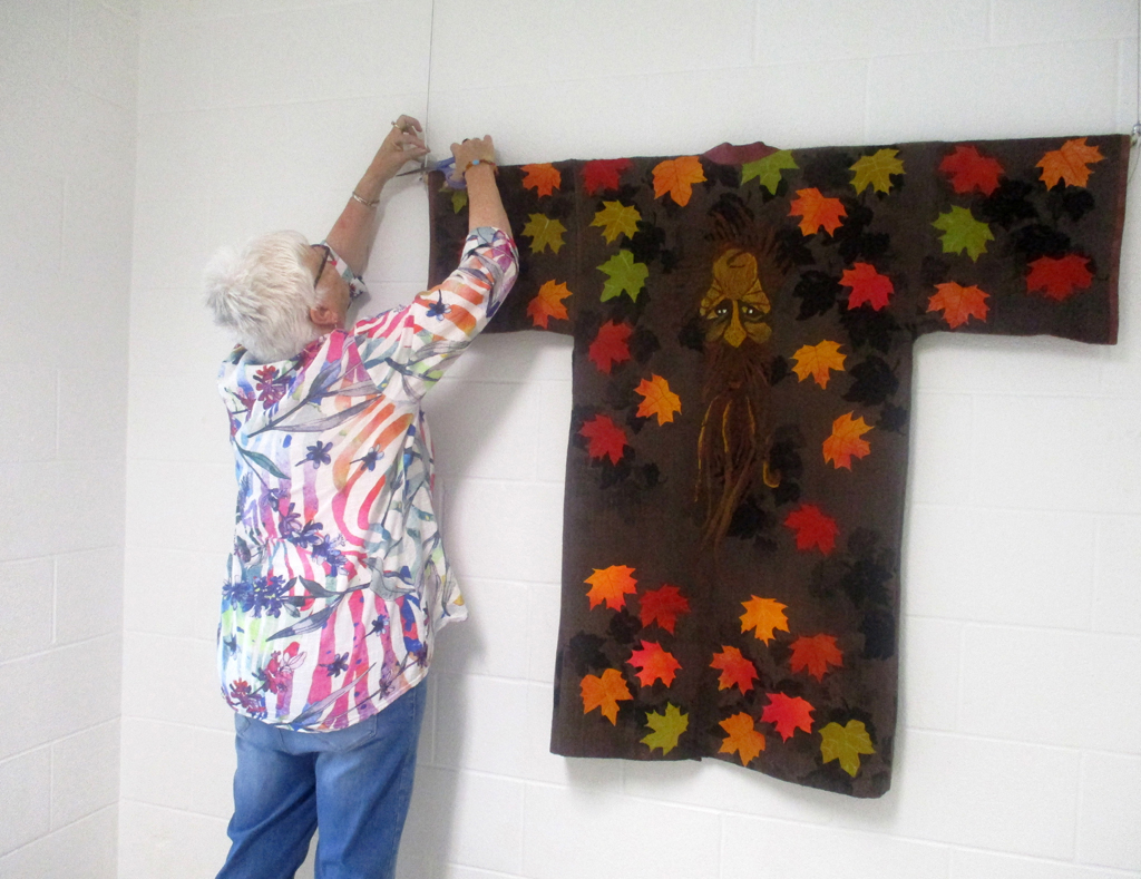 Festival installer: Chris, installing Cat Walk III, World of Threads Festival 2023-24.