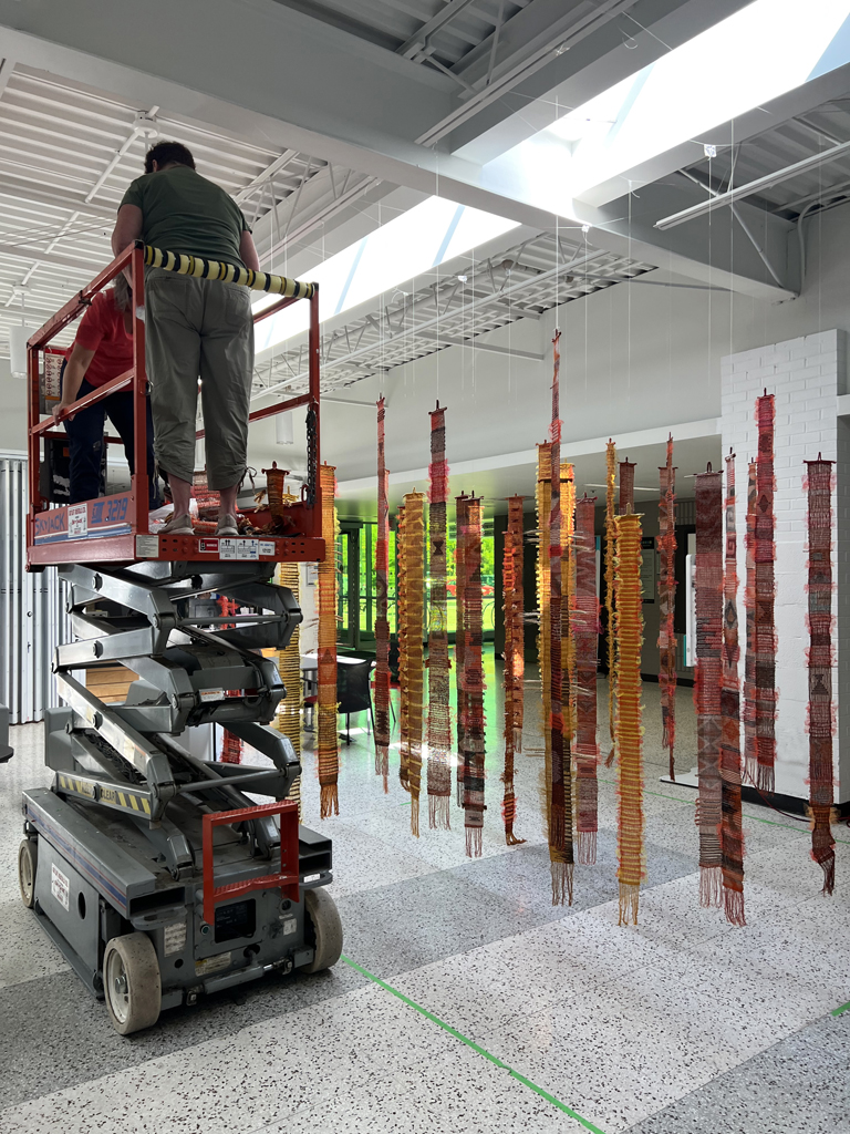 Festival installers: Heidi and Freda, working on the Diaphanous, World of Threads Festival 2023-24.