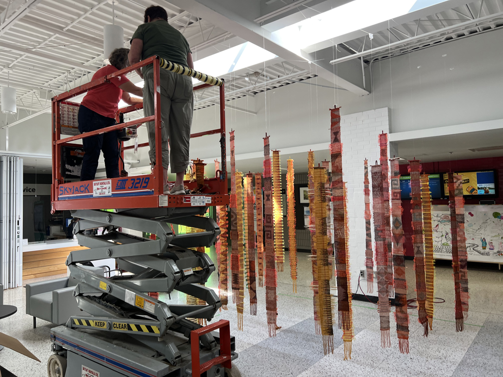 Festival installers: Heidi and Freda, working on the Diaphanous, World of Threads Festival 2023-24.