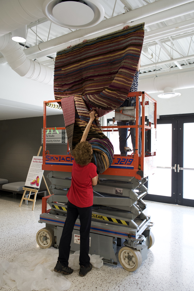 Festival installer: Margaret, installing the Time installation, World of Threads Festival 2023-24.