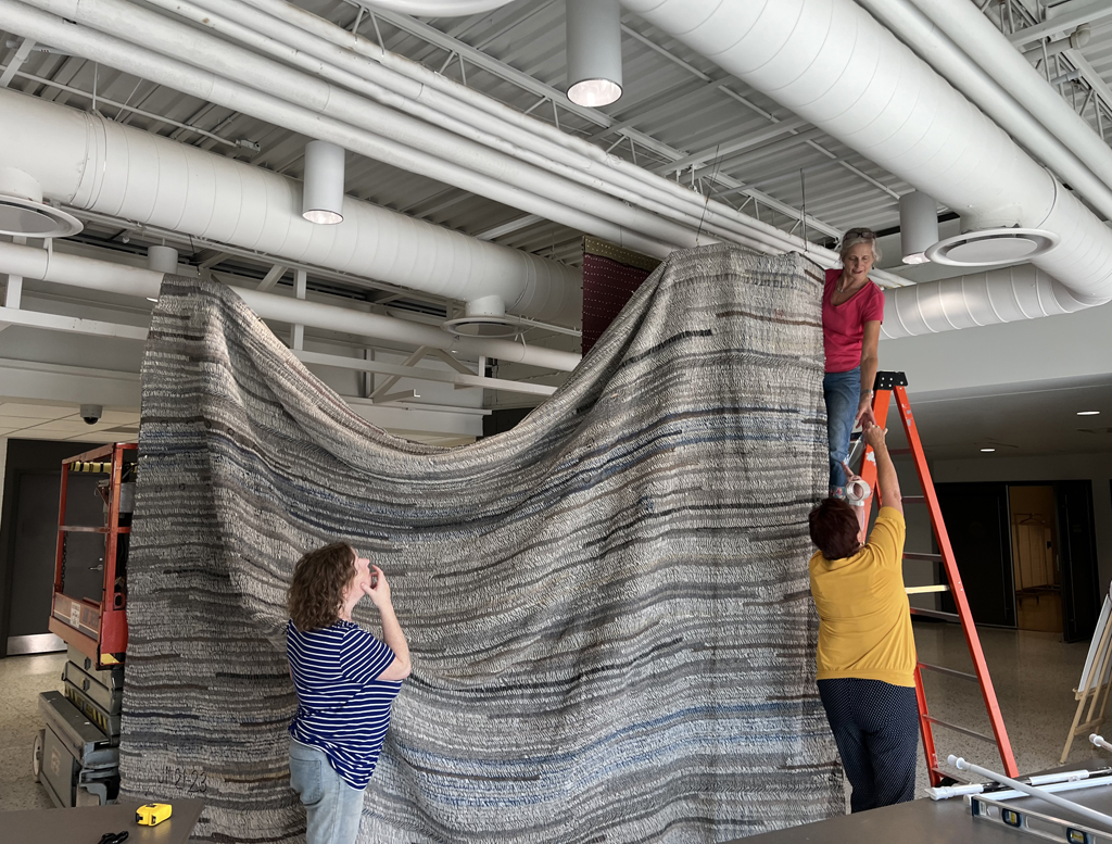Festival installers: Melissa, Freda and Caren installing the Time installation, World of Threads Festival 2023-24.