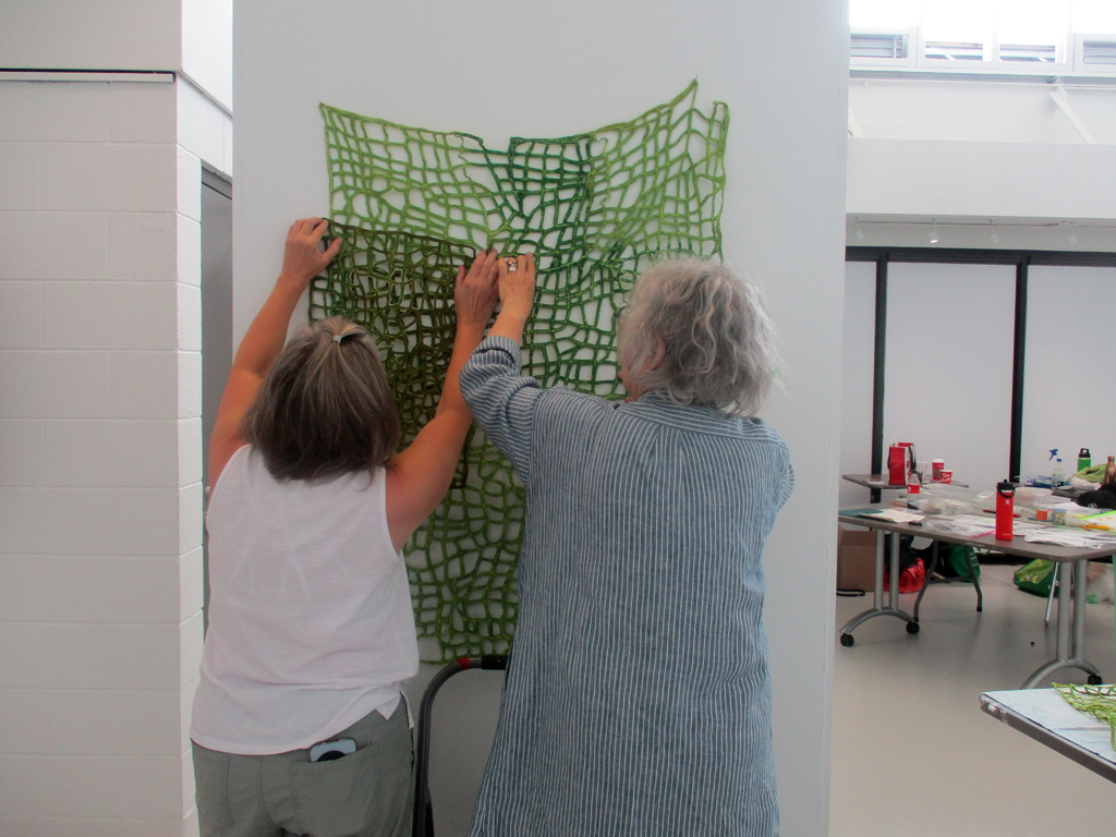 Festival installers Heidi and Carolyn installing.