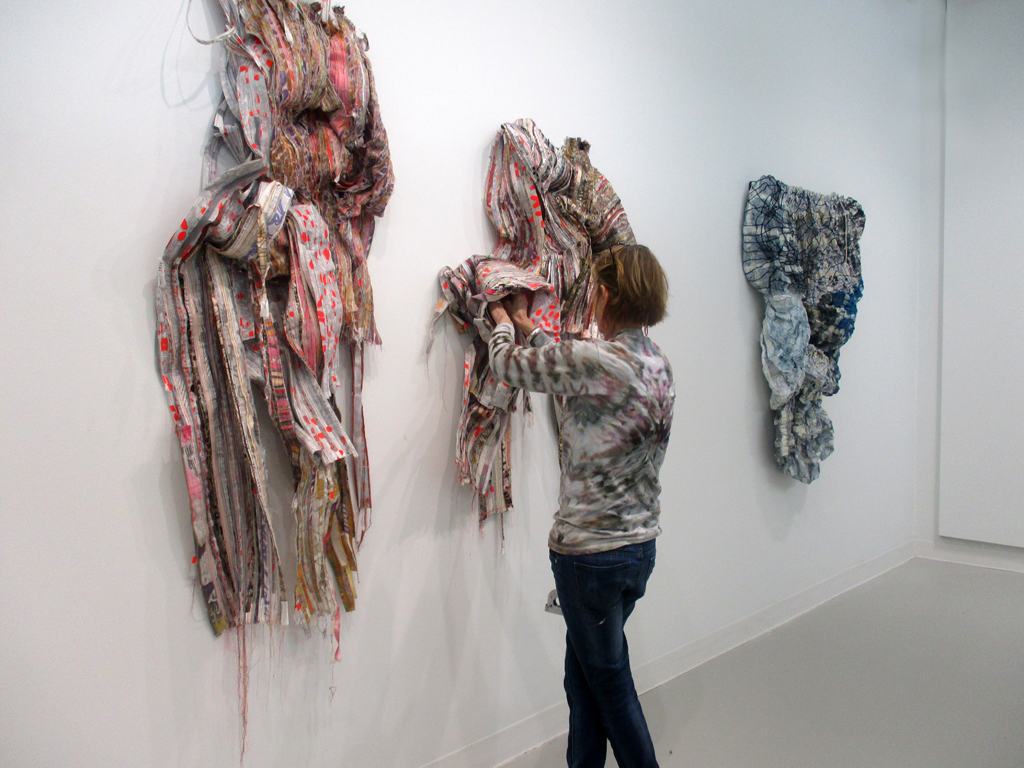 Margery installing her artwork.