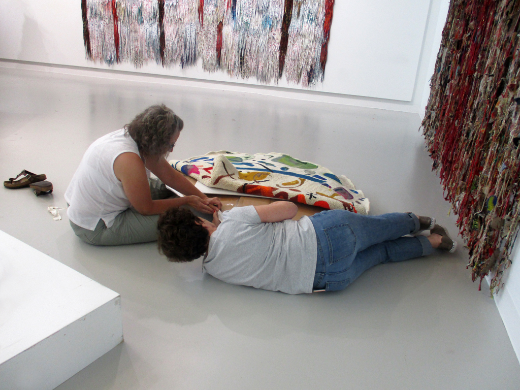 Festival installers Heidi and Carol getting down to business.