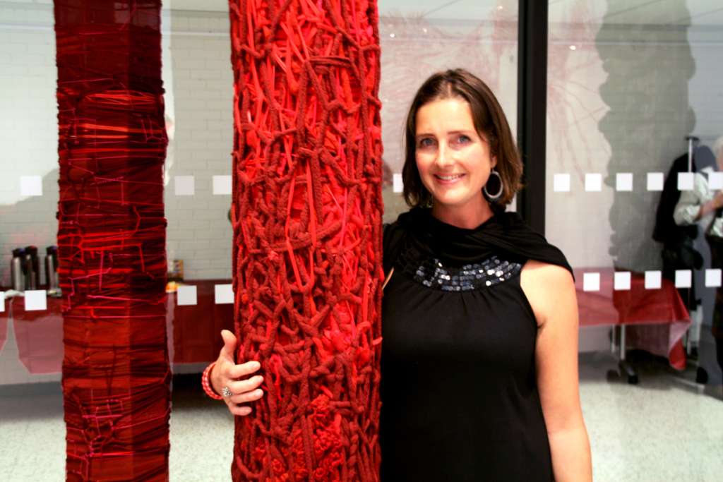 Artist: Julia White at the opening of the World of Threads Festival 2014.