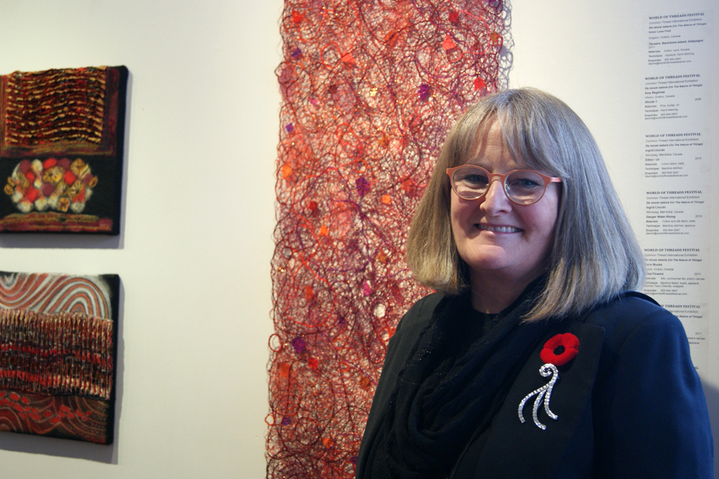 Pat Hertzberg at the opening of the De rerum natura exhibition, World of Threads Festival 2012.