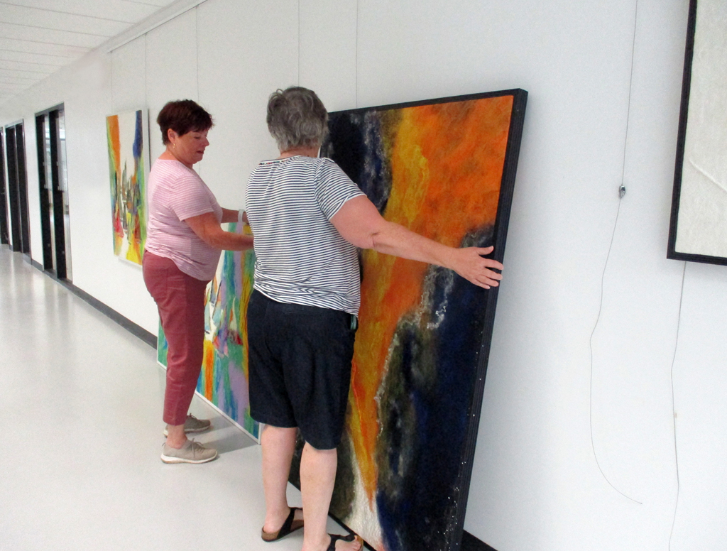 Festival Installers: Freda and Jeanne, installing work by Svetlana Turov, Solo Shows, World of Threads Festival 2023-24.