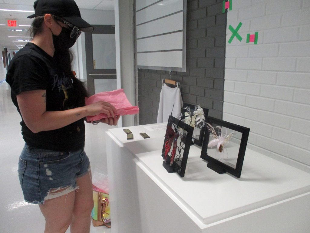 Artist: Breeyn McCarney, installing her artwork, Solo Show, World of Threads Festival 2023-24.