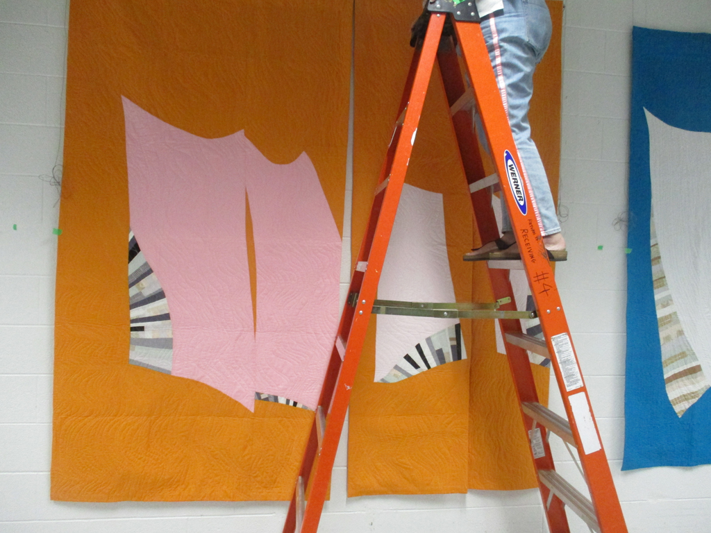 Installing work by Carolyn Murphy, Solo Shows, World of Threads Festival 2023-24.