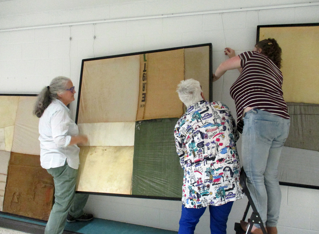 Festival Installers: Jean, Chris and Melissa, installing work by BR Goldstein, Solo Shows, World of Threads Festival 2023-24.