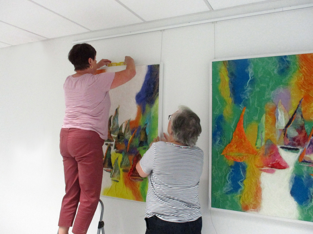 Festival Installers: Freda and Jeanne, installing work by Svetlana Turov, Solo Shows, World of Threads Festival 2023-24.