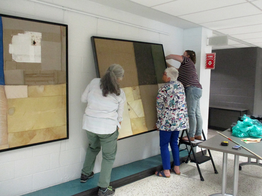 Festival Installers: Jean, Chris and Melissa, installing work by BR Goldstein, Solo Shows, World of Threads Festival 2023-24.