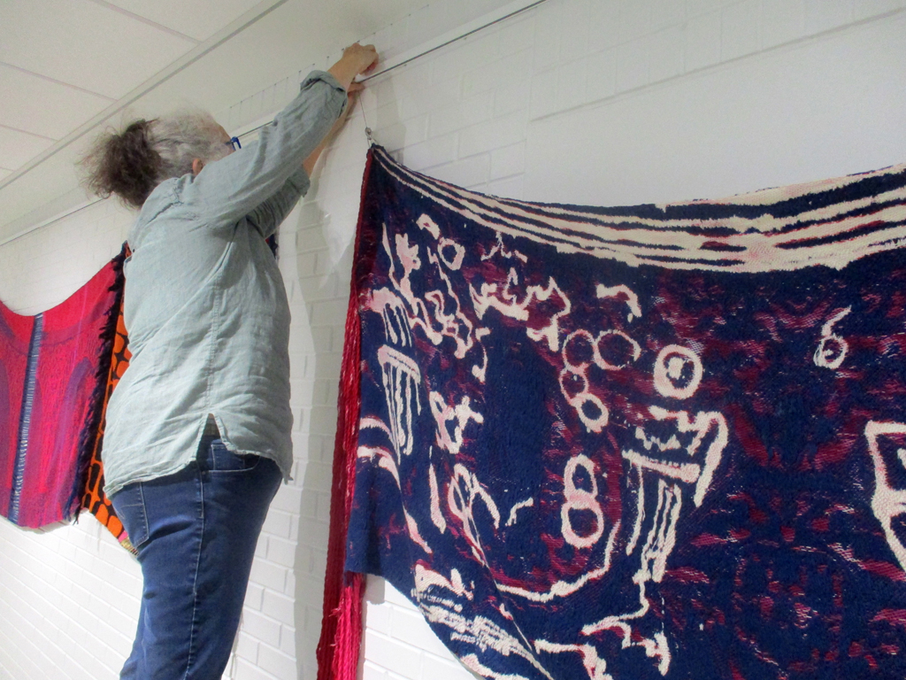 Festival Installer: Jean, installing work by C Pazia Mannella, Solo Show, World of Threads Festival 2023-24.