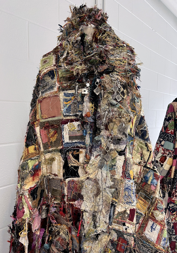 The Travelers Coat, detail, Melanie Siegel, Cat Walk III, World of Threads Festival 2023-24.