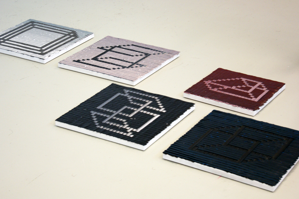 Laying out ready for installing artwork for The Red and the Black exhibition, World of Threads Festival 2014.