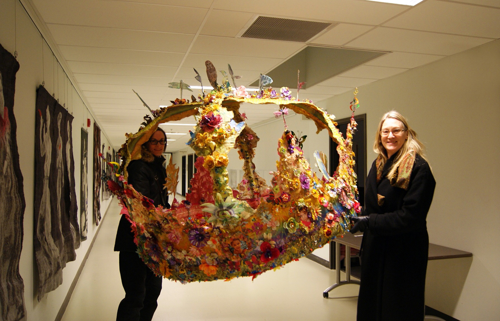 Artist: Jacqueline Treloar delivering her installation, World of Threads Festival 2014.