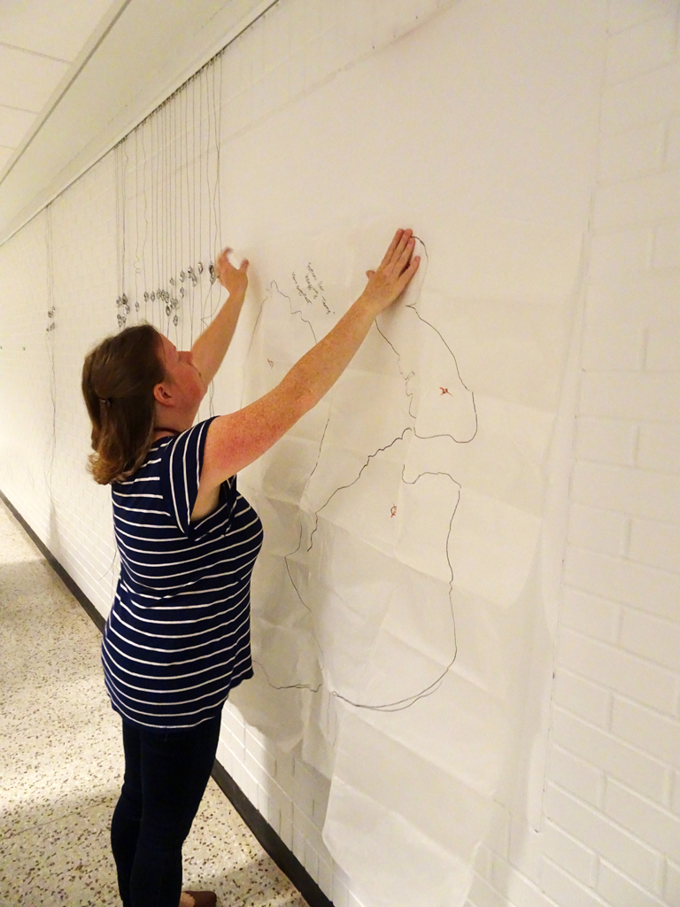 Festival installer: Melissa, installing work by Marie Bergstedt, WWW: Whimsical, Wacky and Wild exhibition, World of Threads Festival 2016.