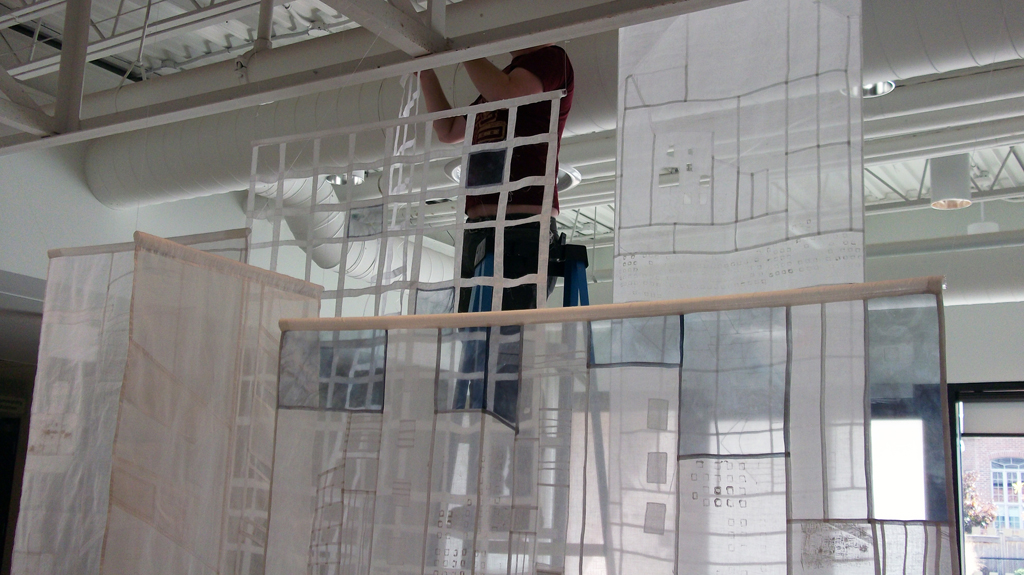 Installing Karen Goetzinger's "A State of Transparency" installation, World of Threads Festival 2014.