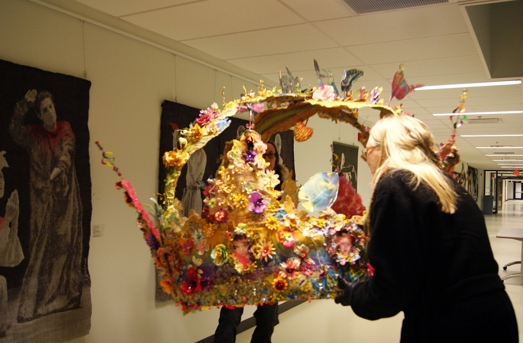 Artist: Jacqueline Treloar installing her installation, World of Threads Festival 2014.
