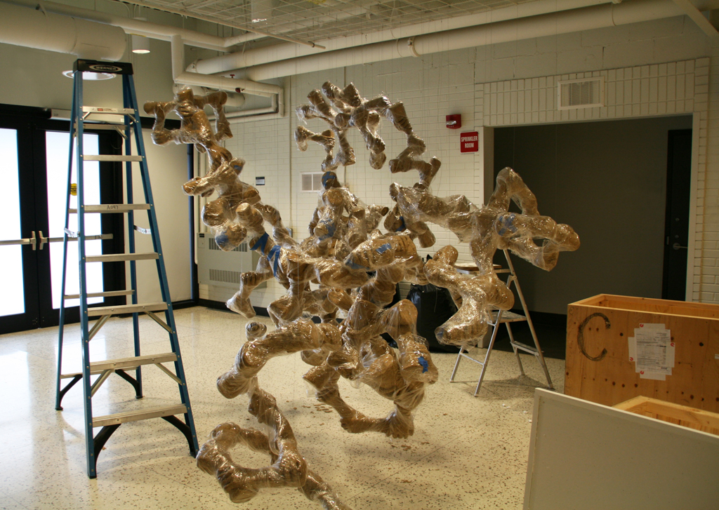 Installing art installation by Marianne Kyryluk, World of Threads Festival 2016.