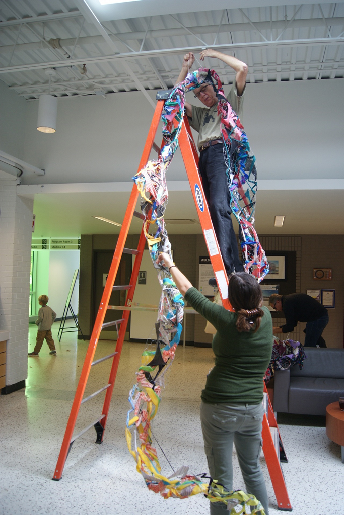 Dad, Mr Tripp Morrow, installing art installation by Olivia, World of Threads Festival 2016.