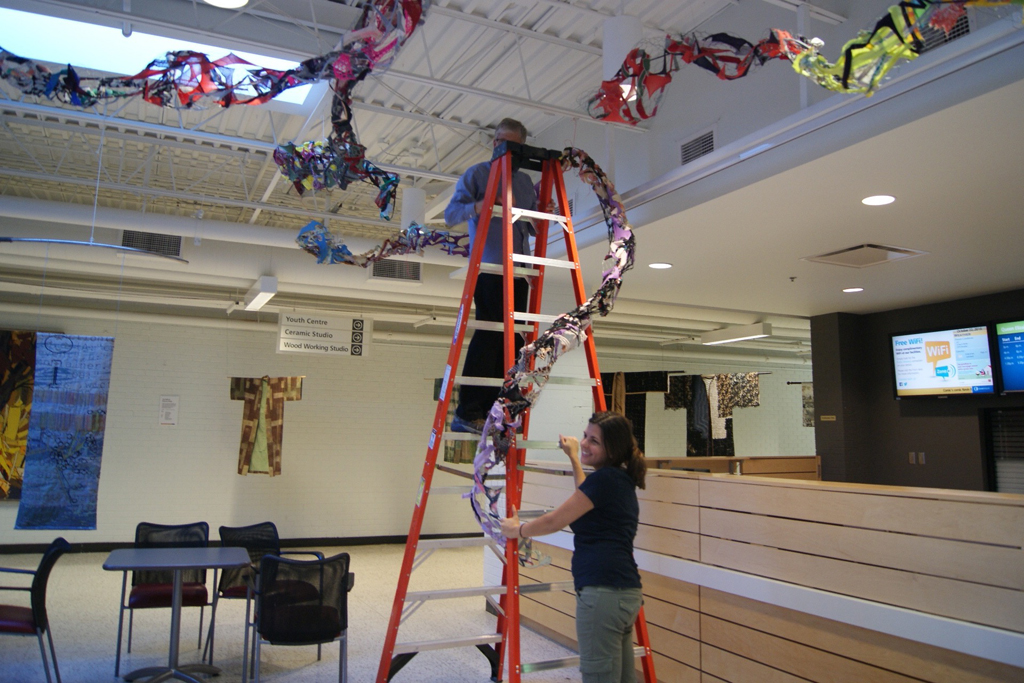 Dad, Mr Tripp Morrow, installing art installation by Olivia, World of Threads Festival 2016.
