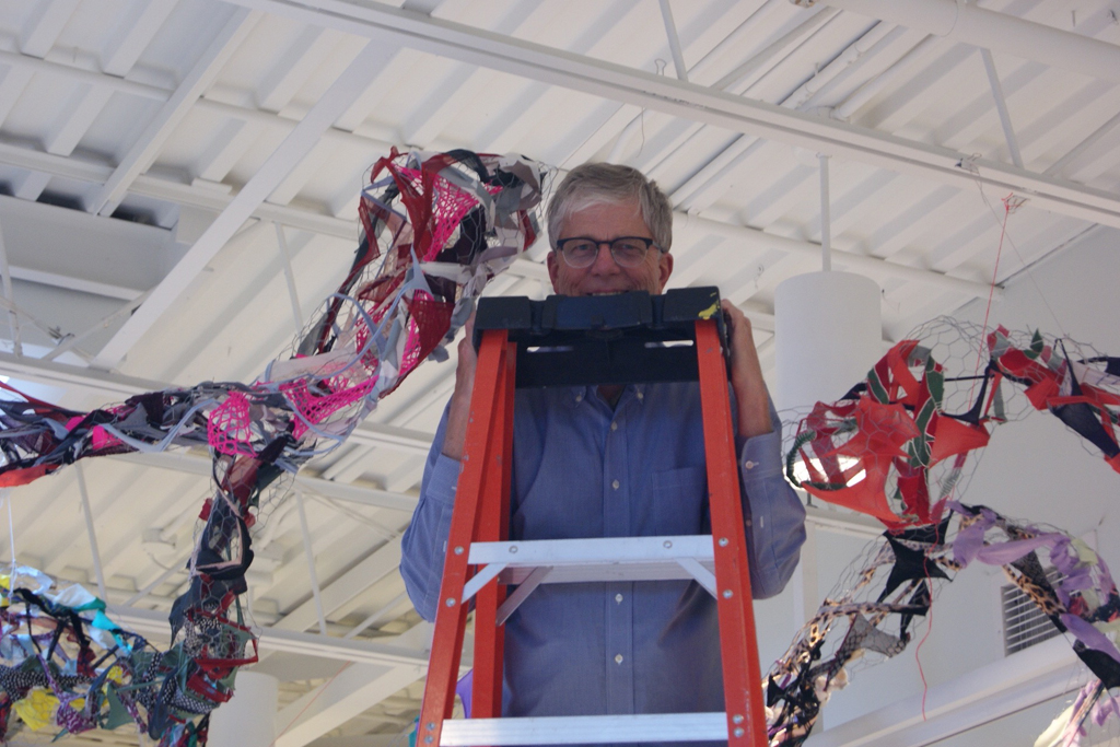 Dad, Mr Tripp Morrow, installing art installation by Olivia, World of Threads Festival 2016.